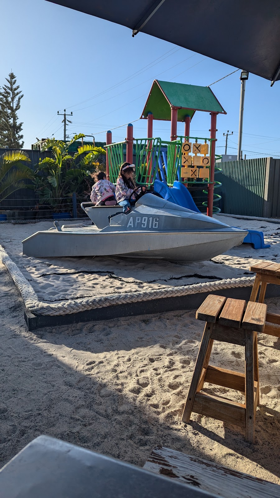 The kids' playground in the beer garden, with a little boat sitting in the sandpit